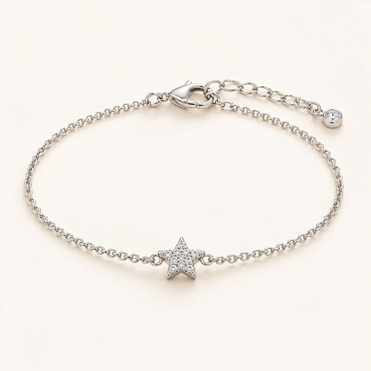 Starlit Thread in Silver, fine chain bracelet with one small five-point star centerpiece pave set with clear cubic zirconia, lobster clasp and extender