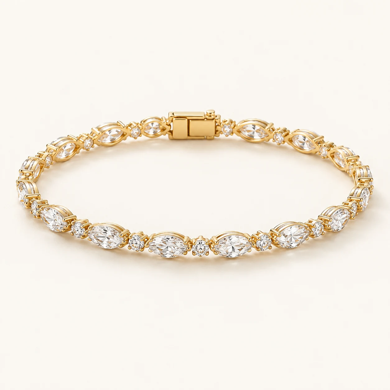 Marquise Muse in Gold, tennis bracelet, alternating marquise shaped clear cubic zirconia and small round clear cubic zirconia, box clasp, no extender
