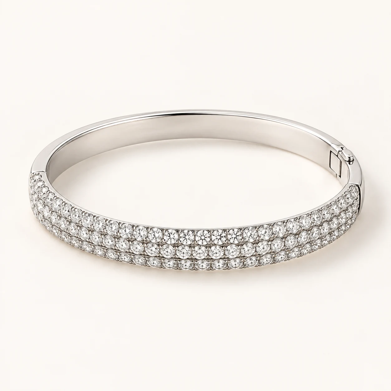 Nocturne Cuff in Silver, wide hinged oval rigid bangle, precisely three parallel rows of round clear cubic zirconia on front half, solid plain silver back half